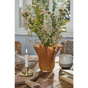 Poppy-vase med blomstrende gren
  i varm tone